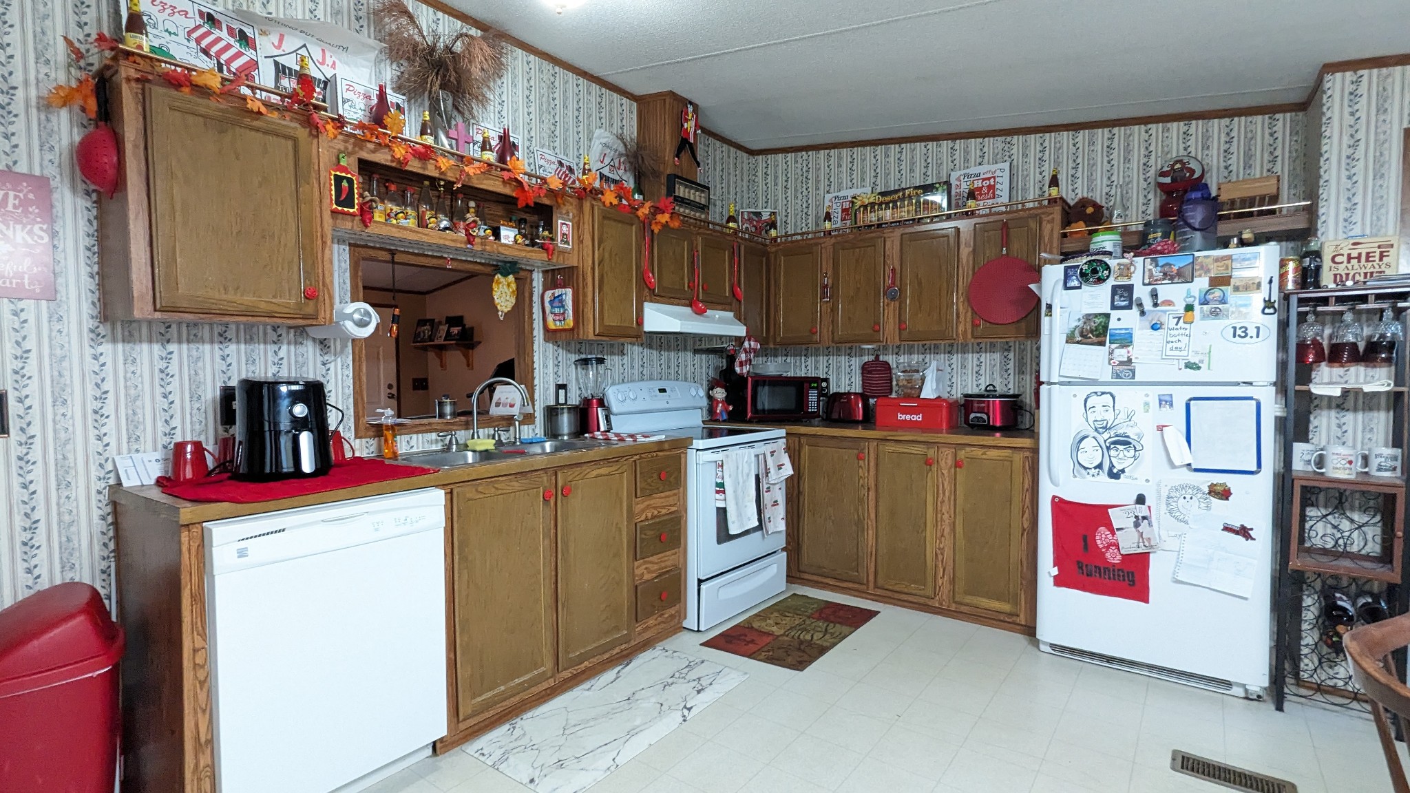 1473 North Sumner Road Bethpage, TN 37022 - Photo 10 of 40 a kitchen with refrigerator and cabinets