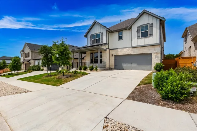 a view of house with yard and entertaining space