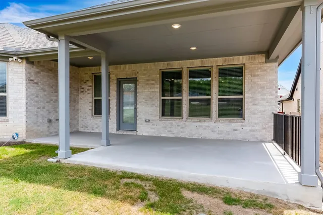 a view of a swimming pool with outdoor seating