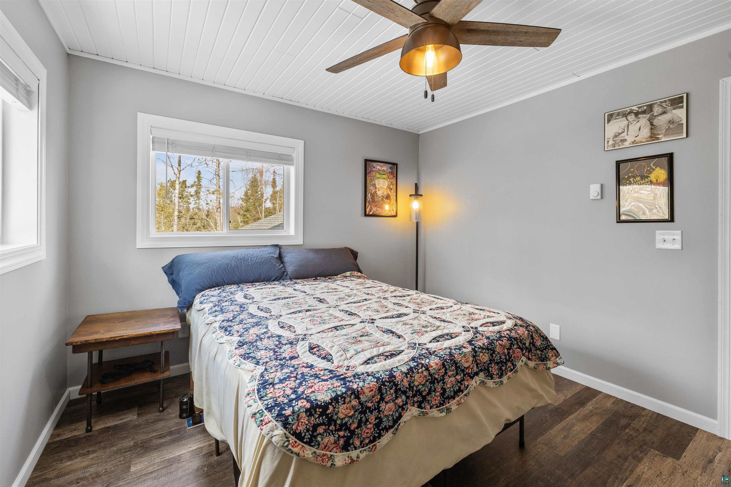 13462 Villa Road Ely, MN 55731 - Photo 11 of 68 Upper level bedroom featuring wooden ceiling, a ceiling fan, and Lifeproof flooring.