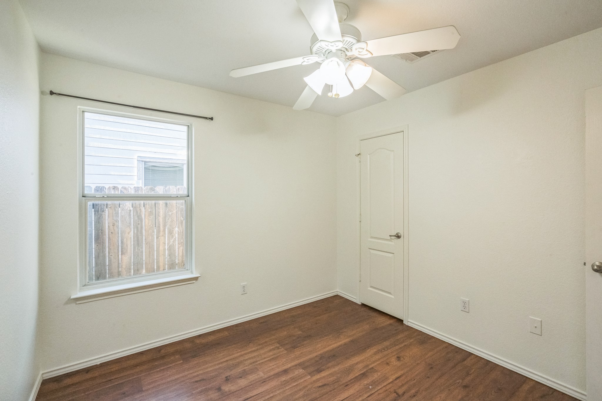 77 Jan Lane Georgetown, TX 78626 - Photo 16 of 16 Natural light illuminates rich hardwood flooring in this cozy, versatile room.