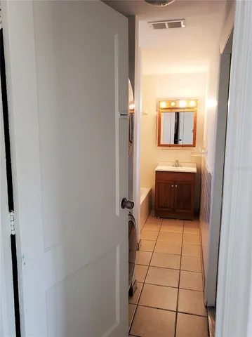 a bathroom with a sink and mirror