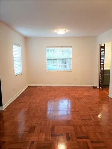 an empty room with an empty space and window