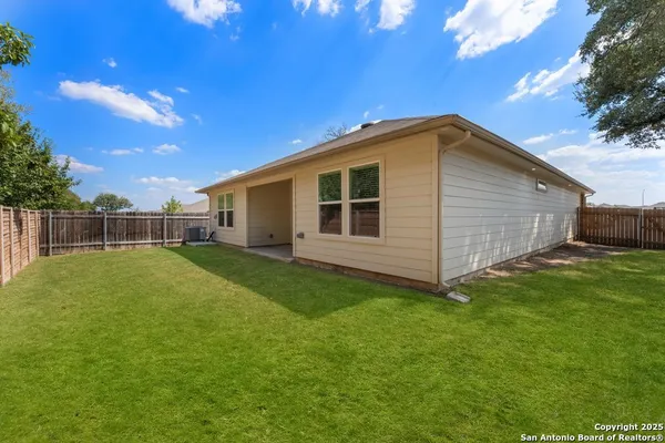 a backyard of a house with lots of green space