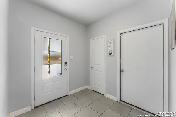 an empty room with windows and closet