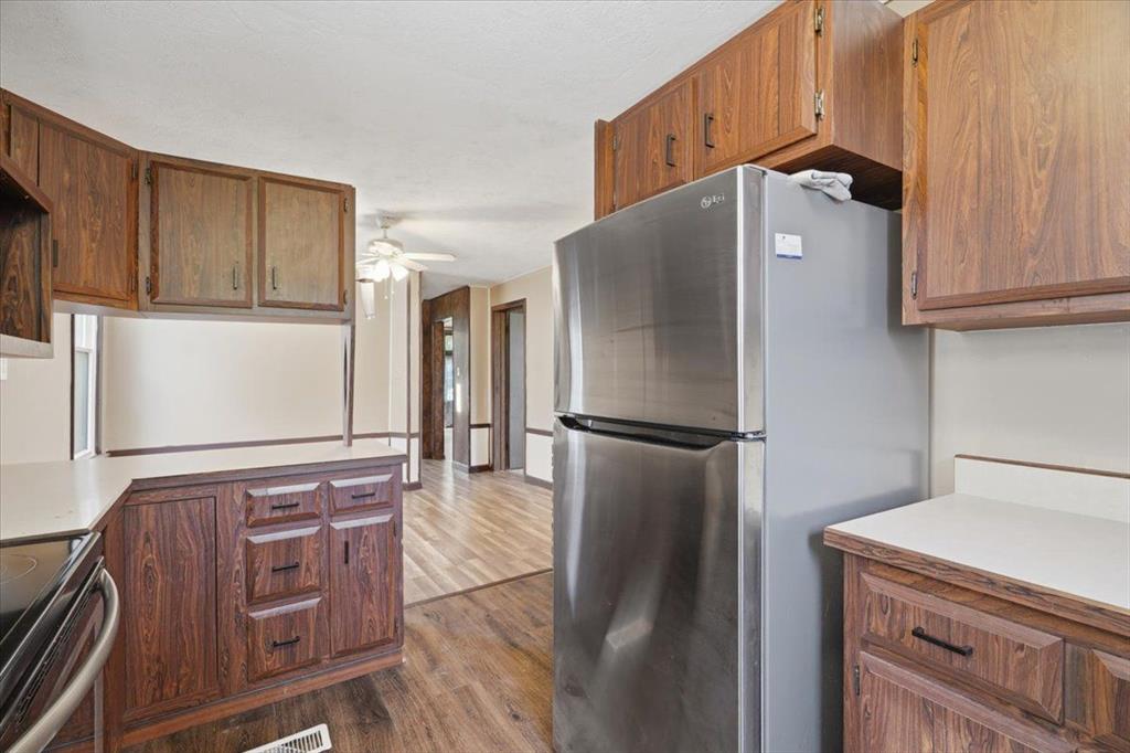 15 Division Street Pittsburgh, PA 15205 - Photo 25 of 44 a kitchen with stainless steel appliances granite countertop a refrigerator and a stove