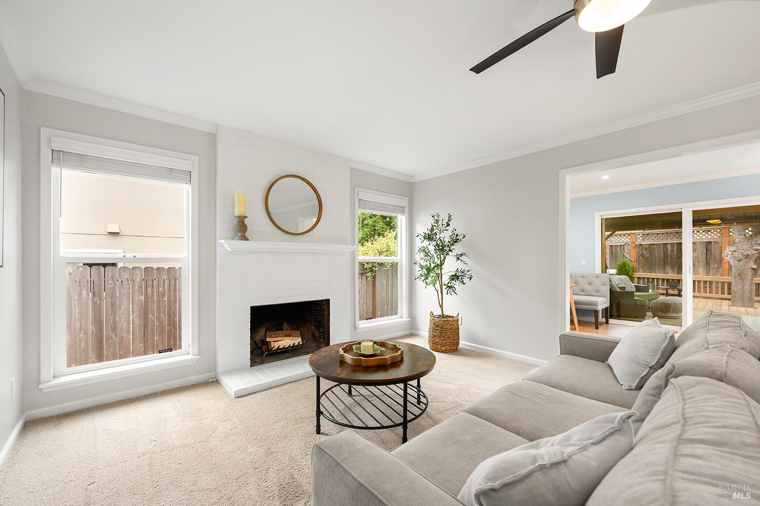 5313 Yerba Buena Road Santa Rosa, CA 95409 - Photo 6 of 34 Warm and inviting family room features a cozy fireplace, built-in bookshelves, and an open connection to the dining area.