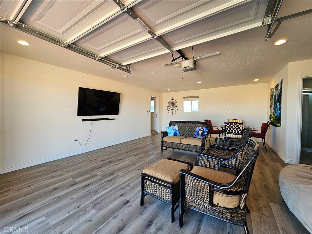 3939 Pinto Mountain Road Twentynine Palms, CA 92277 - Photo 19 of 47 a living room with furniture and a flat screen tv