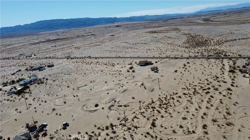3939 Pinto Mountain Road Twentynine Palms, CA 92277 - Photo 33 of 47 a view of wooden floor in middle of a beach