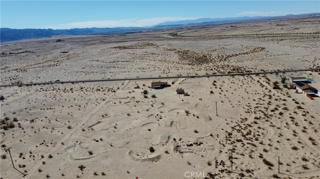 3939 Pinto Mountain Road Twentynine Palms, CA 92277 - Photo 35 of 47 a view of a dry yard with wooden floor