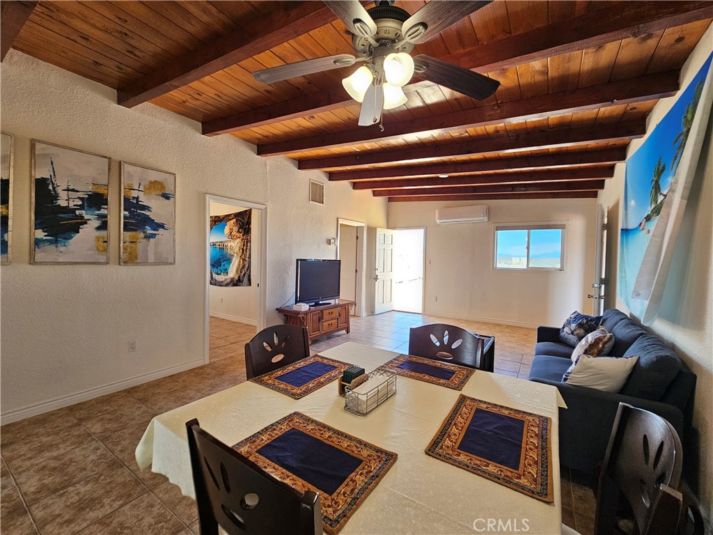 3939 Pinto Mountain Road Twentynine Palms, CA 92277 - Photo 6 of 47 a living room with furniture and a flat screen tv