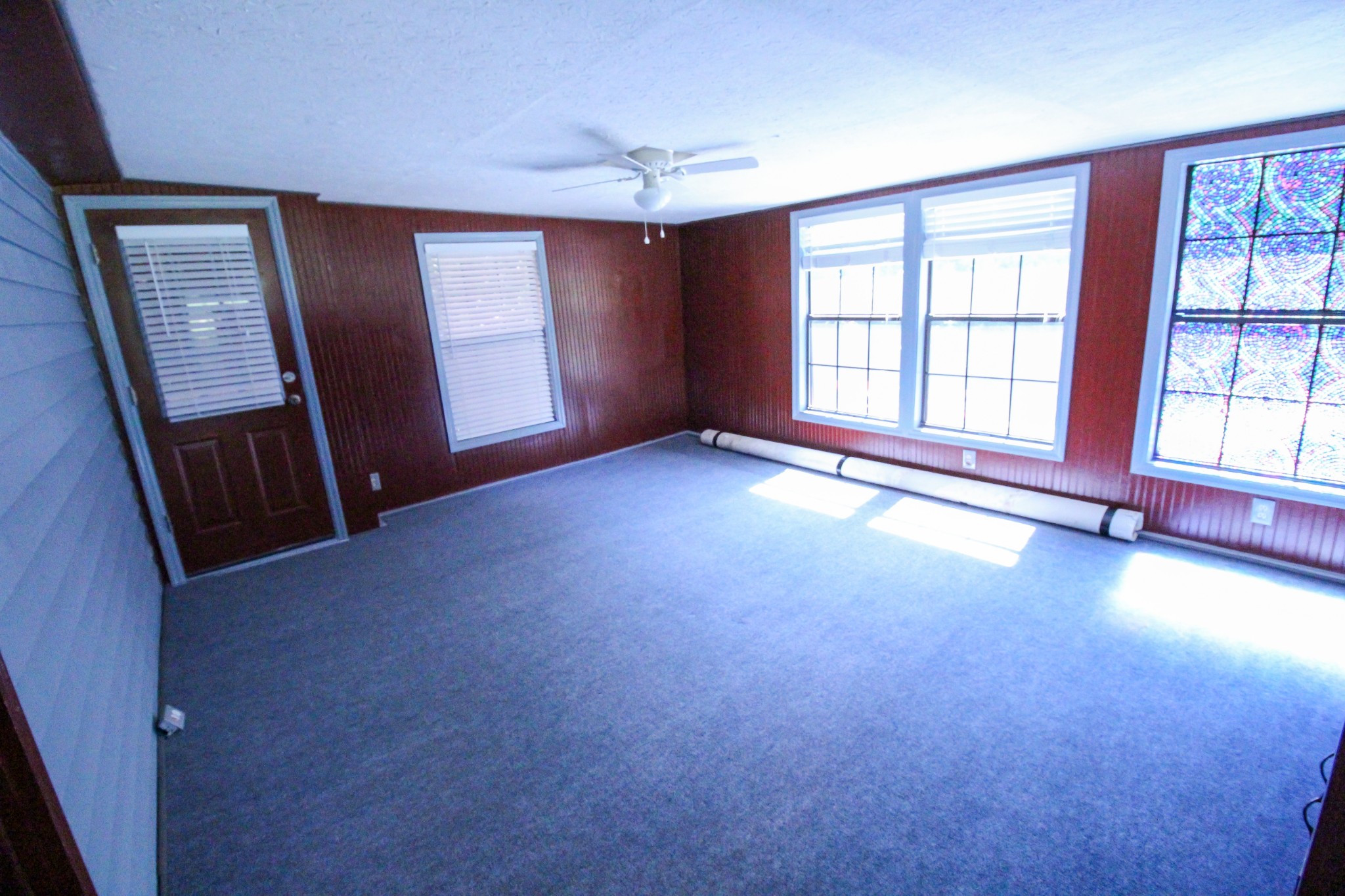 2628 Gideon Road Greenbrier, TN 37073 - Photo 17 of 40 wooden floor and windows in an empty room