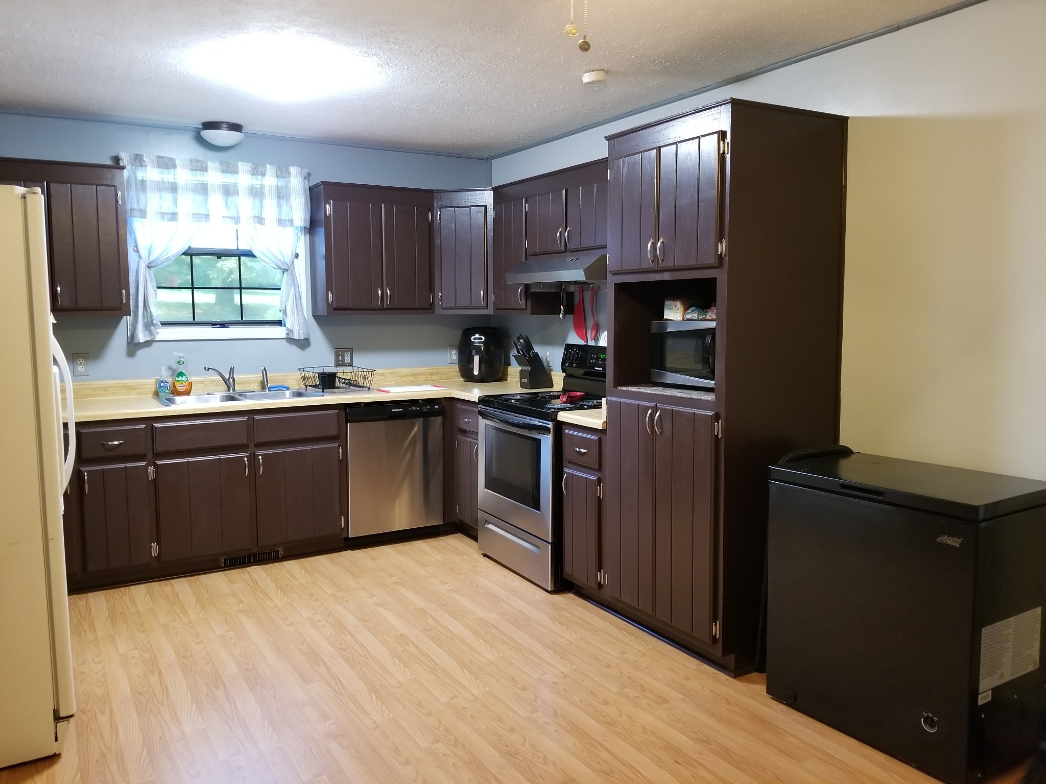 2628 Gideon Road Greenbrier, TN 37073 - Photo 10 of 40 a kitchen with stainless steel appliances granite countertop a sink stove and refrigerator