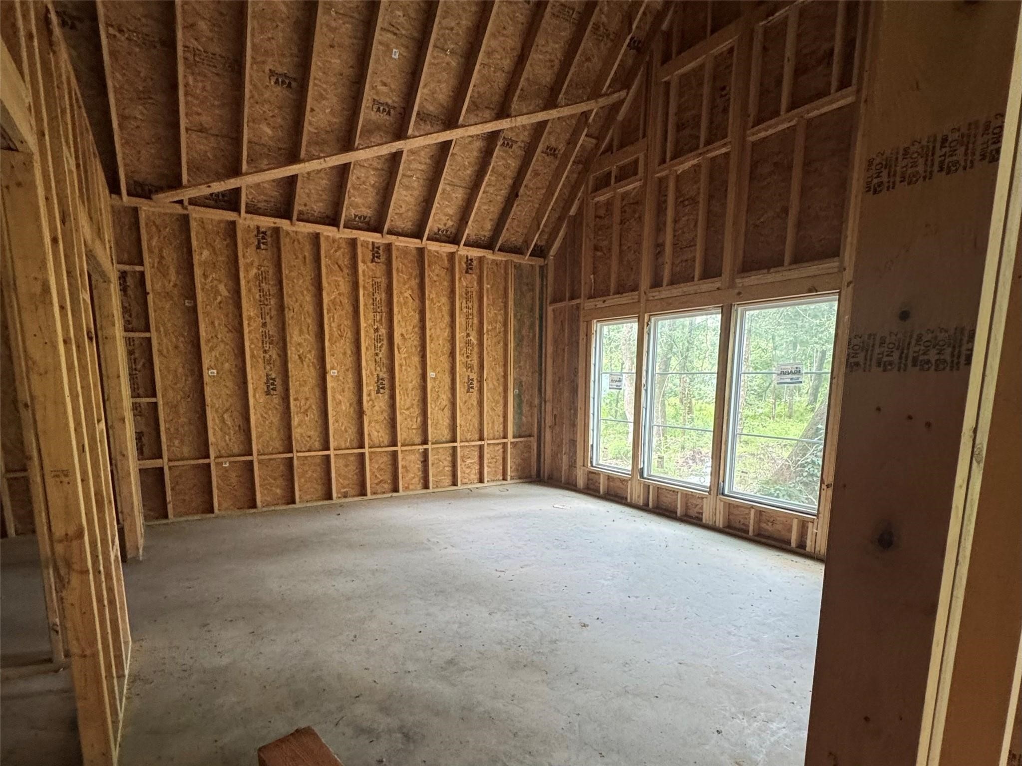 9813 Fm 563 Road Liberty, TX 77575 - Photo 6 of 8 New oversized windows are designed to bring plenty of natural light into the spacious primary bedroom.