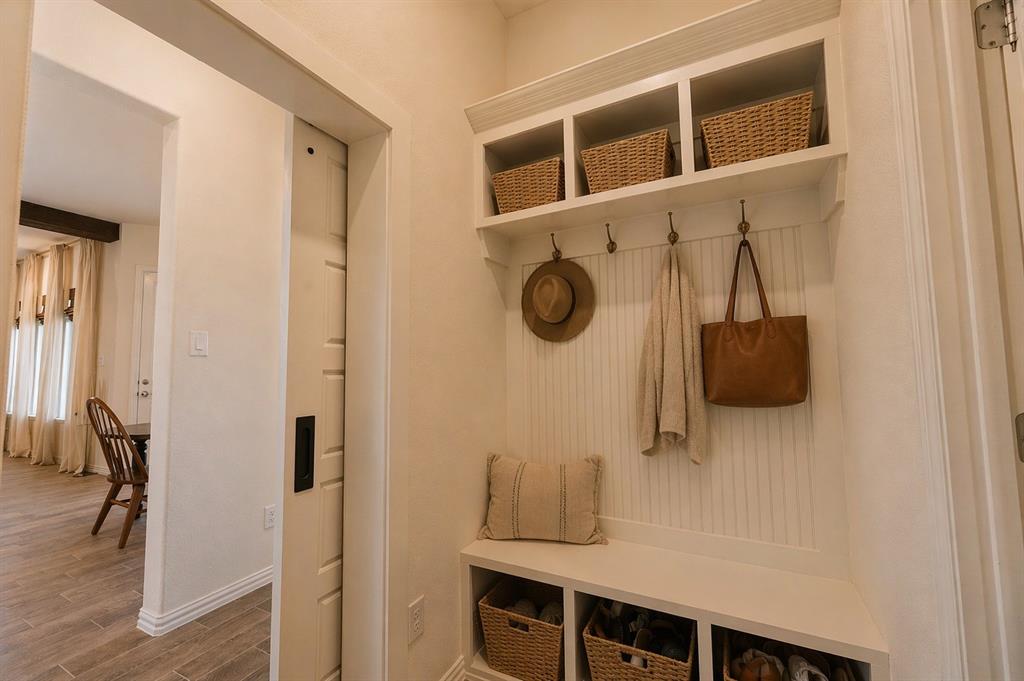 1530 County Road 200 Valley View, TX 76272 - Photo 31 of 34 Built-in mudroom bench with beadboard backing, overhead shelving, and storage cubbies