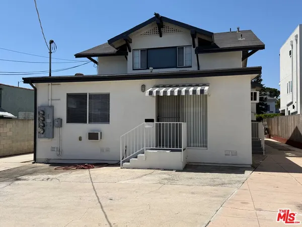 a front view of a house with a garage