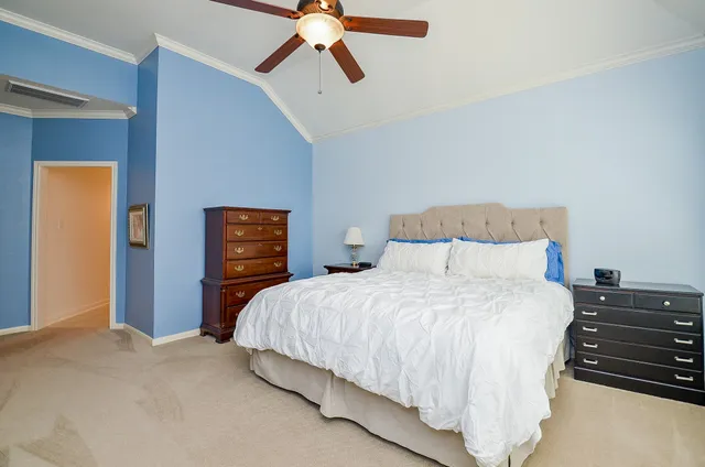 a bedroom with a bed and dresser