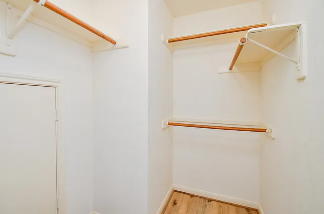 a view of a room with racks on the wall