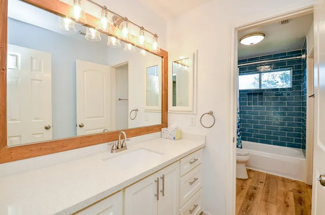 a bathroom with a sink and a mirror