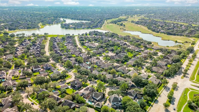 an aerial view of a house with a lake view