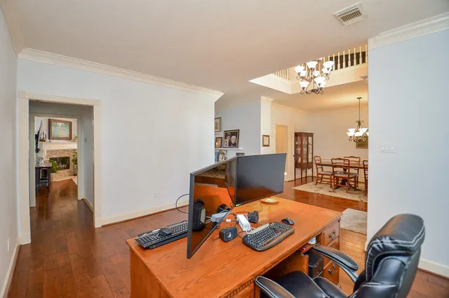a workspace with furniture and wooden floor