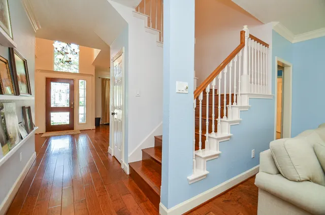 a view of staircase with wooden floor and staircase
