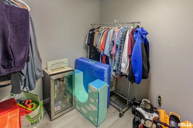 a bedroom with furniture and flat screen tv