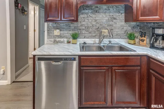 a bedroom with a bed and a cabinets