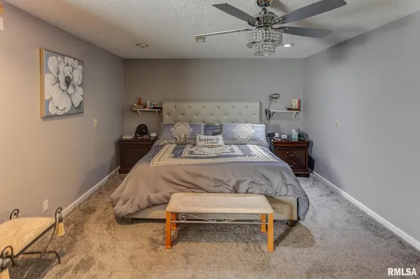 a bath tub sitting next to a white sink and vanity