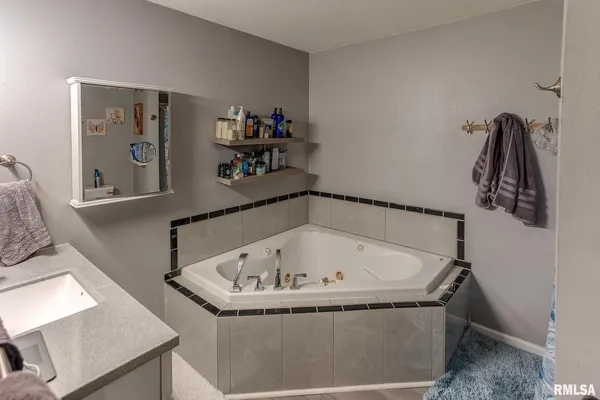 a bathroom with a bathtub and a shower