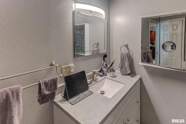 a bathroom with a sink and a mirror