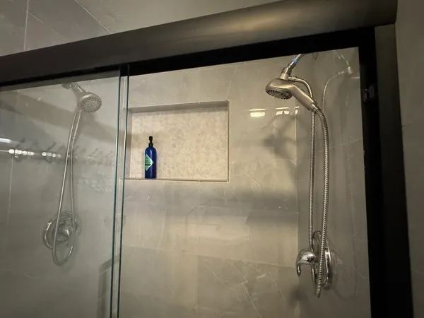 a view of walk in closet with clothes