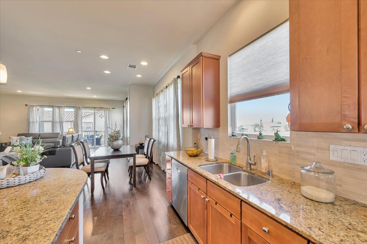 3001 Ruby Avenue San Jose, CA 95135 - Photo 18 of 58 a large kitchen with granite countertop a large window and white appliances