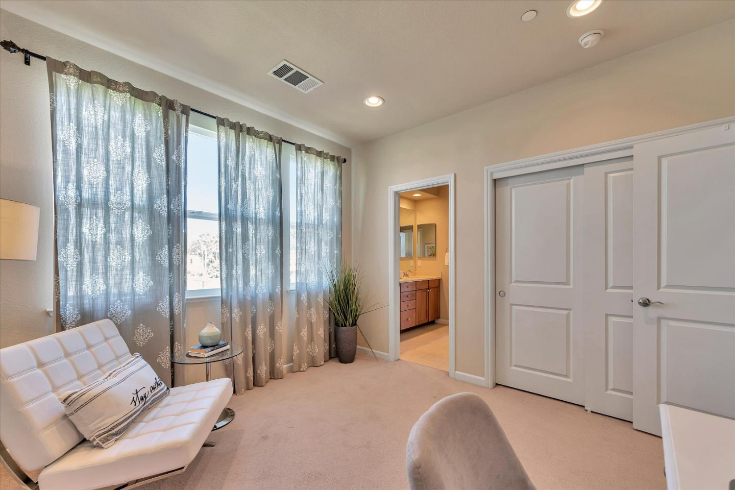 3001 Ruby Avenue San Jose, CA 95135 - Photo 24 of 58 a spacious bedroom with a balcony a bed and a couch
