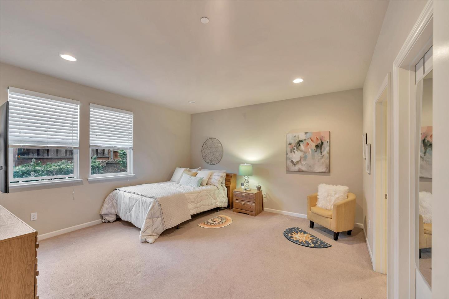 3001 Ruby Avenue San Jose, CA 95135 - Photo 26 of 58 a spacious bedroom with a bed and a window