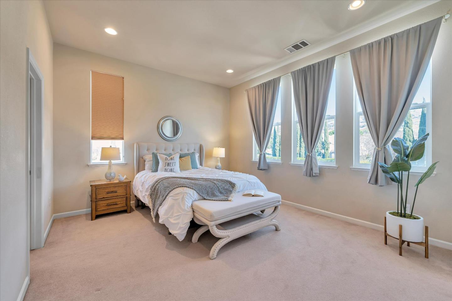 3001 Ruby Avenue San Jose, CA 95135 - Photo 28 of 58 a bedroom with a bed and a potted plant
