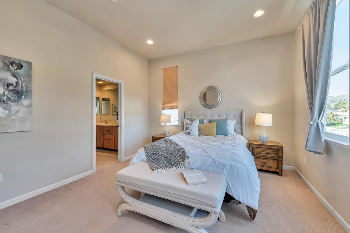 3001 Ruby Avenue San Jose, CA 95135 - Photo 29 of 58 a bedroom with a bed a mirror and a window