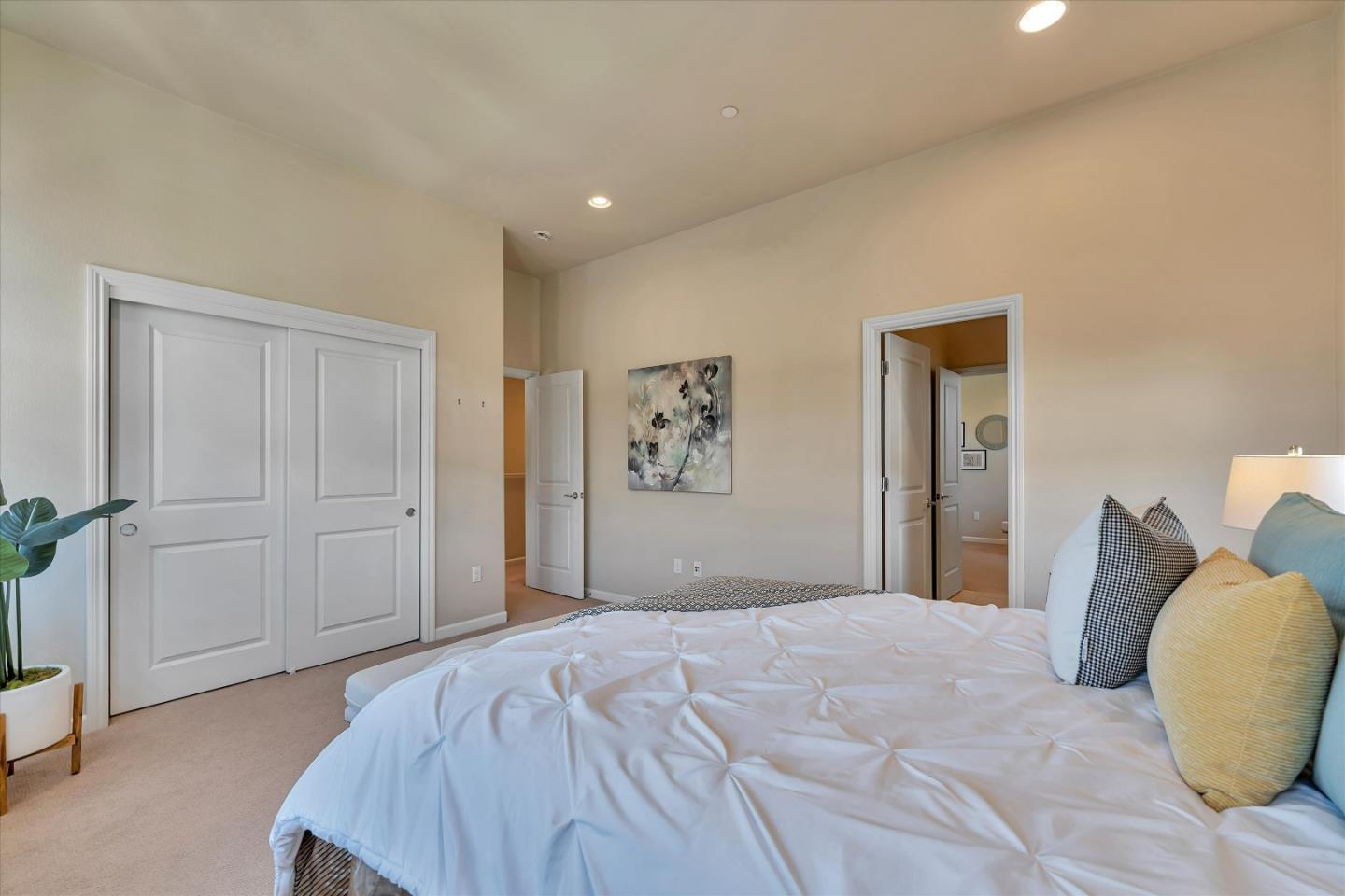3001 Ruby Avenue San Jose, CA 95135 - Photo 30 of 58 a bedroom with a large bed and wooden floor