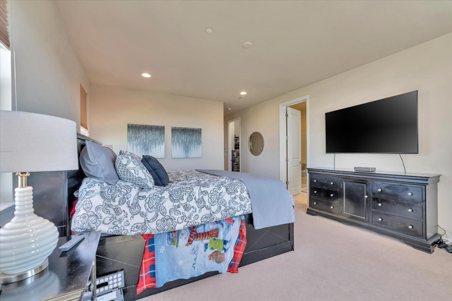 3001 Ruby Avenue San Jose, CA 95135 - Photo 34 of 58 a bedroom with a bed and a flat screen television