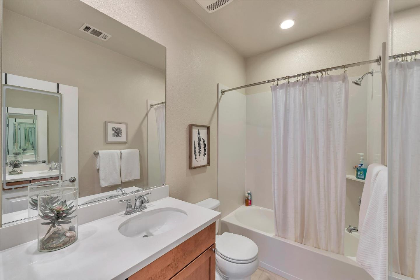 3001 Ruby Avenue San Jose, CA 95135 - Photo 35 of 58 a bathroom with a sink vanity mirror and toilet