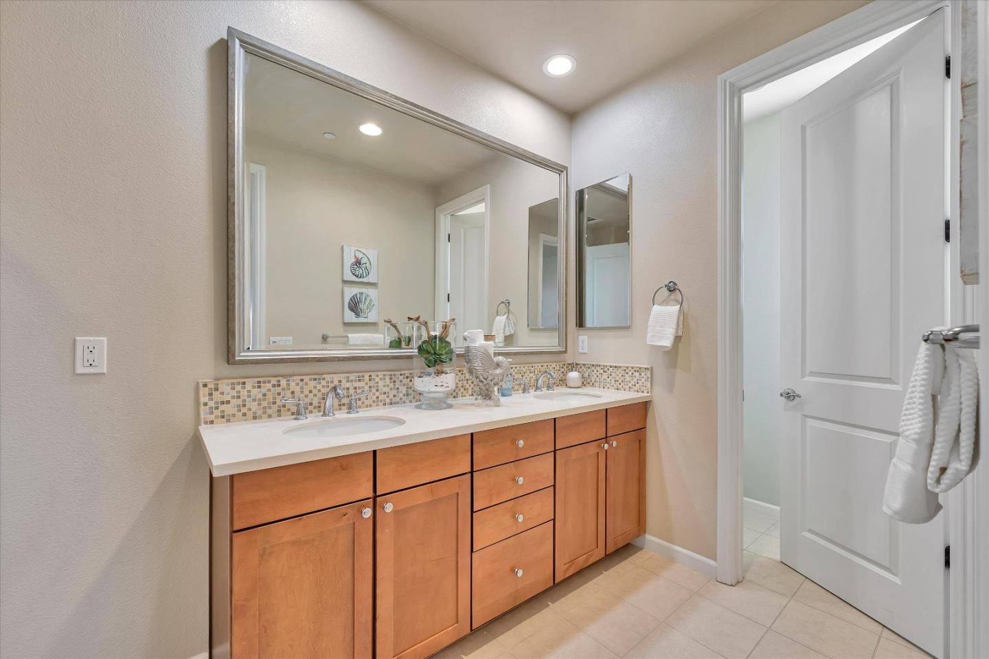 3001 Ruby Avenue San Jose, CA 95135 - Photo 36 of 58 a bathroom with a sink double vanity and a mirror
