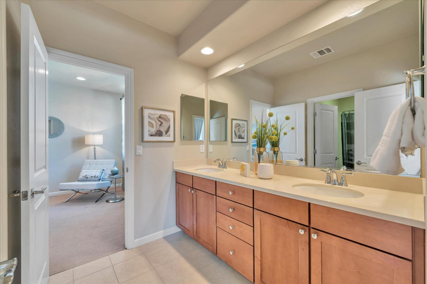 3001 Ruby Avenue San Jose, CA 95135 - Photo 37 of 58 a spacious bathroom with a double vanity sink and a mirror