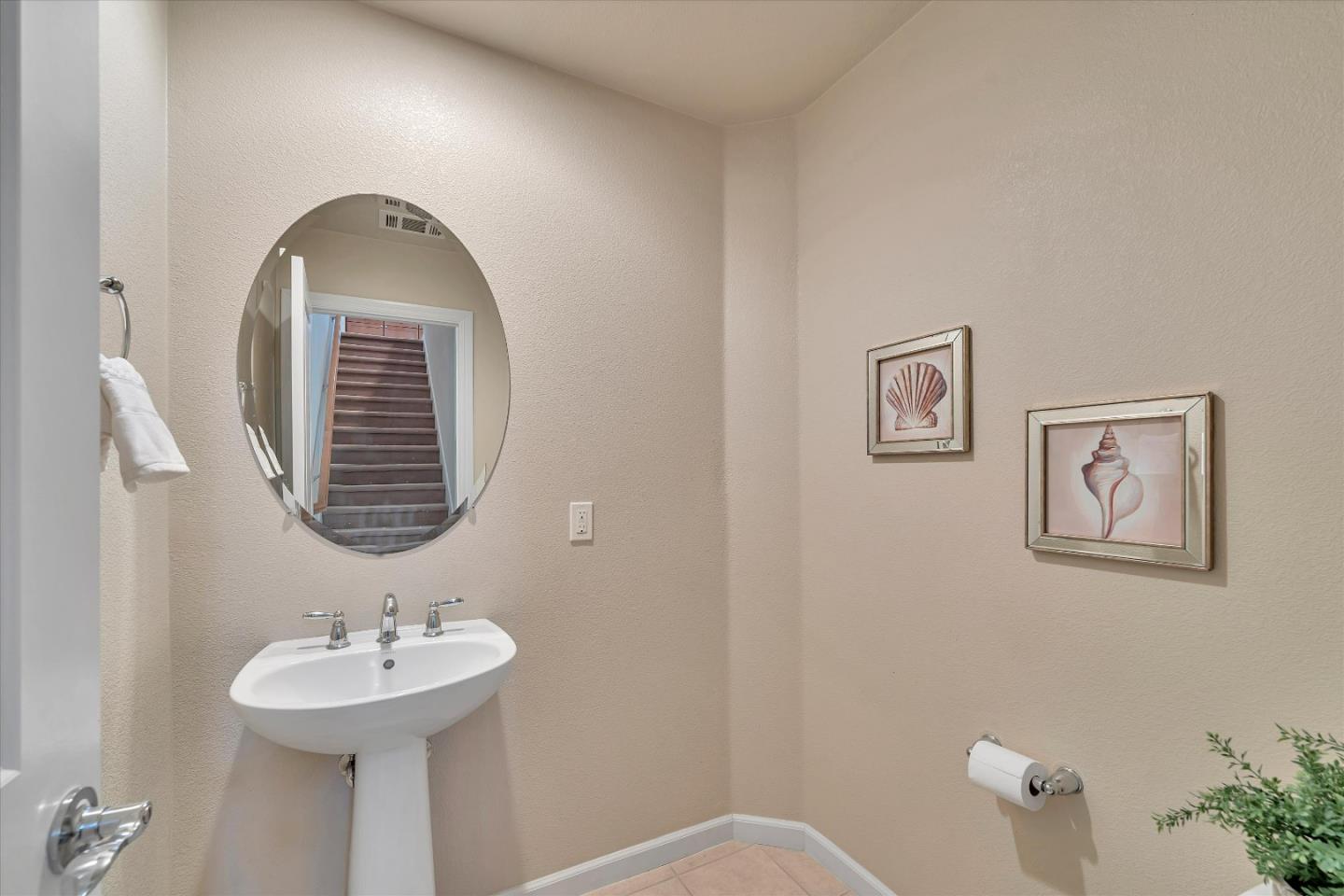 3001 Ruby Avenue San Jose, CA 95135 - Photo 41 of 58 a bathroom with a sink a mirror and a window