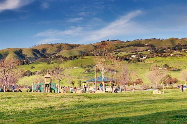 3001 Ruby Avenue San Jose, CA 95135 - Photo 56 of 58 a view of a large building with mountains in the background