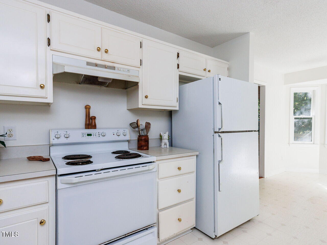 216 Deep Pool Court Benson, NC 27504 - Photo 11 of 37 a kitchen with stainless steel appliances white cabinets sink and a refrigerator