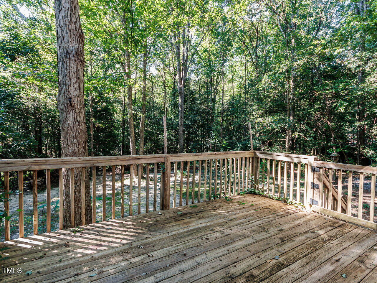 216 Deep Pool Court Benson, NC 27504 - Photo 27 of 37 a balcony with wooden floor and fence