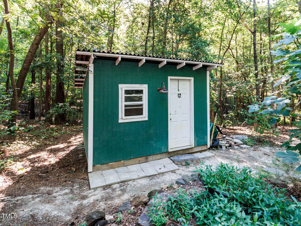 216 Deep Pool Court Benson, NC 27504 - Photo 32 of 37 a front view of a house with garden