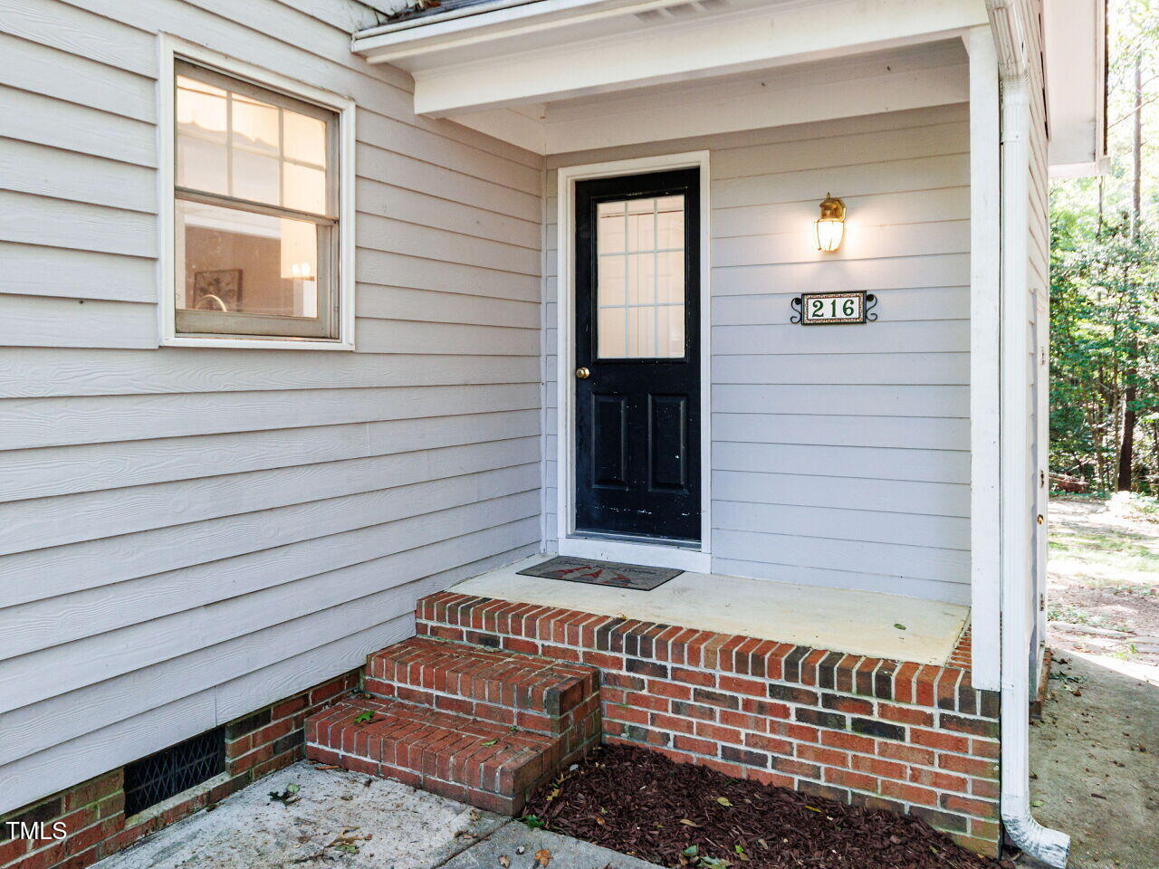 216 Deep Pool Court Benson, NC 27504 - Photo 34 of 37 a view of front door of house