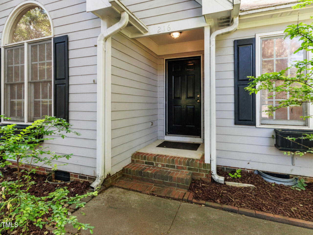 216 Deep Pool Court Benson, NC 27504 - Photo 35 of 37 a front view of a house with plants