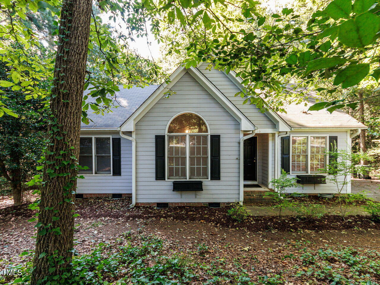 216 Deep Pool Court Benson, NC 27504 - Photo 3 of 37 a front view of a house with garden